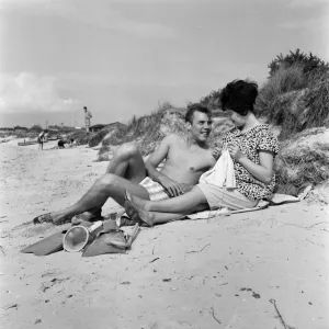 Pop singer Marty Wilde and his 19-year-old wife Joyce on the beach at Shell Bay, Dorset