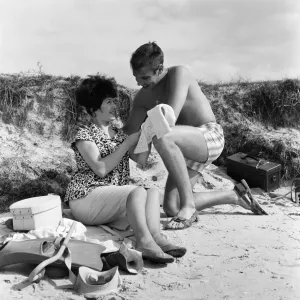 Pop singer Marty Wilde and his 19-year-old wife Joyce on the beach at Shell Bay, Dorset