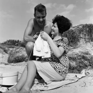 Pop singer Marty Wilde and his 19-year-old wife Joyce on the beach at Shell Bay, Dorset