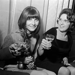 Pop singer Sandie Shaw holding the Mirror award for coming Number One in the Hit parade
