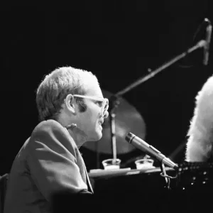 Pop star Elton John on stage at Earls Court, London. This is his first London concert