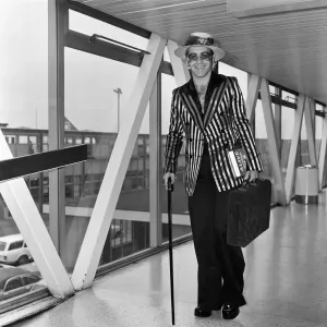 Elton John at Heathrow Airport, 30th August 1974 Print