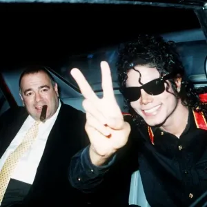 Pop star Michael Jackson gives the V sign as he arrives at Heathrow Airport for a concert Pop star Michael Jackson gives the V sign as he arrives at Heathrow Airport for a concert