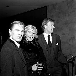 Pop stars Adam Faith, Kathy Kirby and Mike Sarne arriving at the Empire theatre in