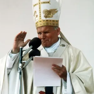 Pope John Paul II delivers his blessing while conducting an open air mass in Bellahouston Pope John Paul II delivers his blessing while conducting an open air mass in Bellahouston