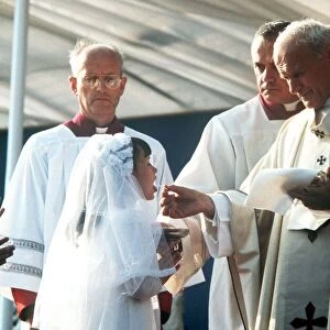 Pope John Paul II giving Holy Communion at Bellahouston Park in Glasgow, Scotland