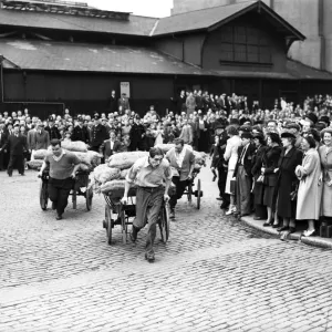 Porters from Covent Garden Flower and Vegetable market race their carts around Porters from Covent Garden Flower and Vegetable market race their carts around