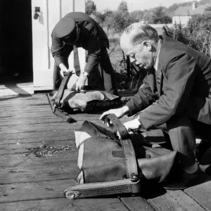 Post Office workers prepare the fitted pouches ready for the quick-release nets so Post Office workers prepare the fitted pouches ready for the quick-release nets so