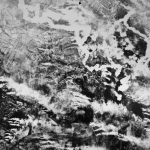 Pouring into swirling, billowing clouds of smoke rising from bomb battered Kiel