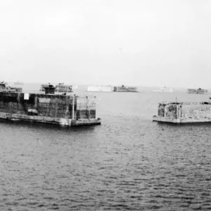 Pre-fabricated ports set down at Mulberry Harbour off the coast of Normandy built to aid