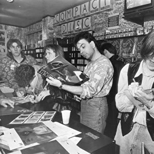 Prefab Sprout sign autographs for fans at the HMV music store in Newcastle