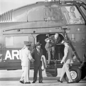 President Eisenhower and his Secretary of State John Foster Dulles seen here disembarking President Eisenhower and his Secretary of State John Foster Dulles seen here disembarking