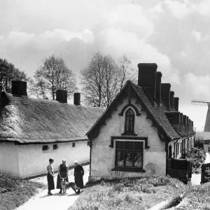 Pretty almshouses and 19th century windmill at Thaxted, North Essex. Circa 1935 Pretty almshouses and 19th century windmill at Thaxted, North Essex. Circa 1935