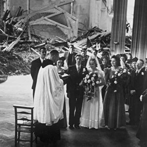 A priest leading a wedding ceremony amongst the ruins of a bombed church as life goes