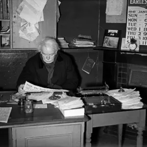 Former Prime Minister David Lloyd George, sitting at a desk, reading the Daily Telegraph Former Prime Minister David Lloyd George, sitting at a desk, reading the Daily Telegraph