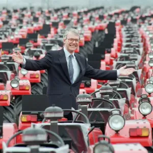 Print of John Major surrounded by tractors at Massey Ferguson Print of John Major surrounded by tractors at Massey Ferguson