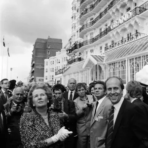Prime Minister Margaret Thatcher and Conservative Chairman Norman Tebbit return to Prime Minister Margaret Thatcher and Conservative Chairman Norman Tebbit return to