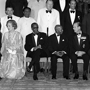 Prime Minister Margaret Thatcher seated with Queen Elizabeth IIand Prince Philip in