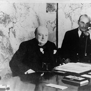 Prime Minister Winston Churchill, (left) pictured in his underground bunker in Whitehall