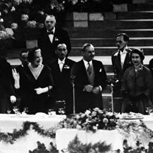Prime Minister Winston Churchill proposes three cheers for the new Queen at a banquet