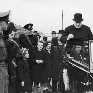 Prime Minister Winston Churchill sitting on the back of an open car on his surprise visit Prime Minister Winston Churchill sitting on the back of an open car on his surprise visit