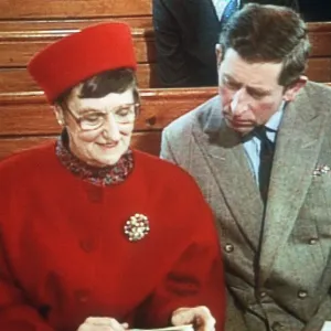 Prince Charles in church with woman sharing book 1992