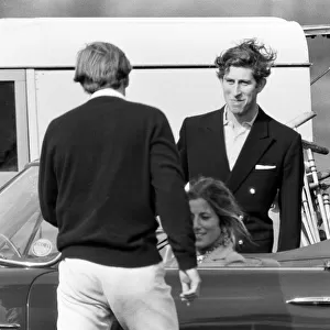 Prince Charles goes for a drive in his Aston Martin with a mystery girl companion at