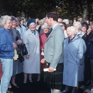 Prince Charles in kilt meeting people