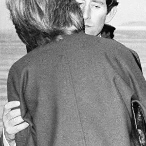 Prince Charles kisses Lady Diana Spencer goodbye at Heathrow Airport before leaving for