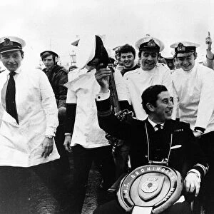Prince Charles leaves the Navy for good in December 1976 with toilet seat round his