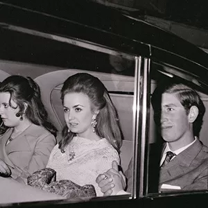 Prince Charles with Lucia Santa Cruz (centre) in car on theie way to the Fortune Theatre