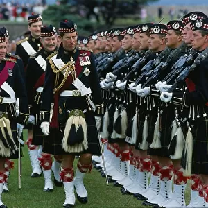 Prince Charles Prince of Wales inspecting troops with highland uniform / kilt at Fort