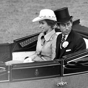Prince Charles, Prince of Wales with his sister Princess Anne drive down the course at
