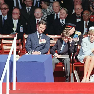 Prince Charles, Prince William, Diana Princess of Wales holding the hand of her son