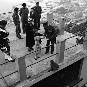 Prince Charles and Princess Anne May 1954 are given food to feed the Barbary Apes