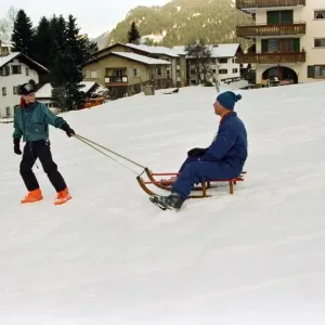 Prince Charles is pulled on a sledge by Prince Harry while on holiday in Klosters Prince Charles is pulled on a sledge by Prince Harry while on holiday in Klosters