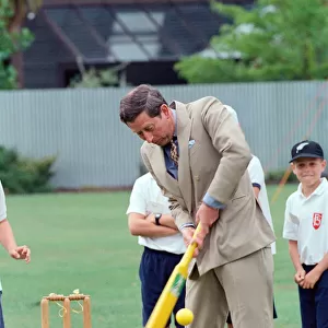 Prince Charles tries his hand at cricket during a visit to Fendalton Primary School