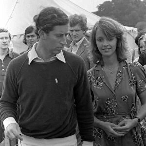 Prince Charles walks along with Sabrina Guinness at polo match at Cowday Park