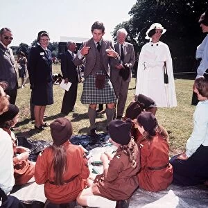 Prince Charles wears kilt whilst talking to Brownies in 1977