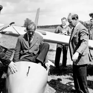 Prince Philip climbs into the cockpit while Peter Scott Looks on (right) Prince Philip climbs into the cockpit while Peter Scott Looks on (right)