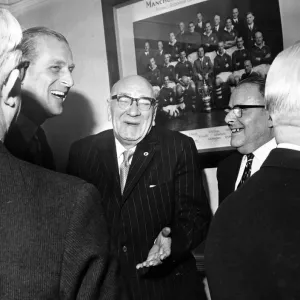 Prince Philip, Duke of Edinburgh shares a joke with Directors in the board room at Maine Prince Philip, Duke of Edinburgh shares a joke with Directors in the board room at Maine