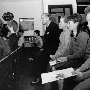 Prince Philip, Duke of Edinburgh takes a seat in the Heritage Centre classroom at Wigan