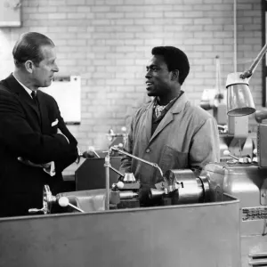 Prince Philip, Duke of Edinburgh takes an interest in the work of Adeddyin Otenaike of Prince Philip, Duke of Edinburgh takes an interest in the work of Adeddyin Otenaike of