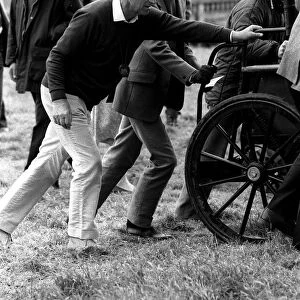 Prince Philip helping to push a carriage. Windsor horse show. May 1987