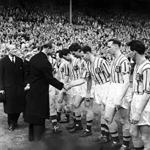 Prince Philip shakes hands with the Aston Villa team May 1957 before the Aston