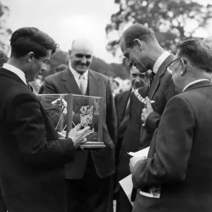 Prince Philip visiting Wales. David De Lloyd presents HRH with a modernistic ashtray