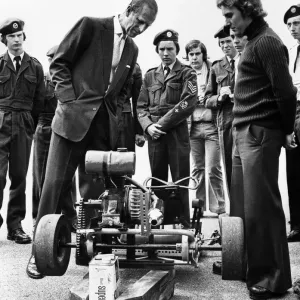 Prince Philip visiting Wales. The Duke of Edinburgh looks at a Go-cart made by members of Prince Philip visiting Wales. The Duke of Edinburgh looks at a Go-cart made by members of