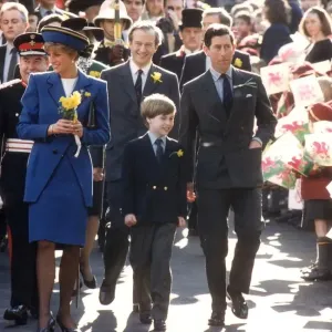 Black and white print of the Prince and Princess of Wales with their son