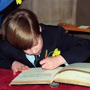 Prince William signing a Visitors Book in Wales on St. Davids Day