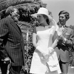 Princess Anne and Prince Charles watch a traditional dance of welcome alongside